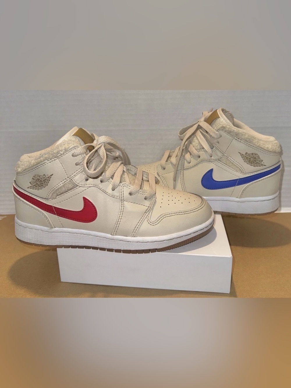 Nike Kids Beige High-Top Sneakers with Red and Blue Swooshes